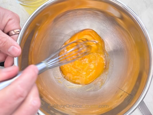 whisking egg and vanilla