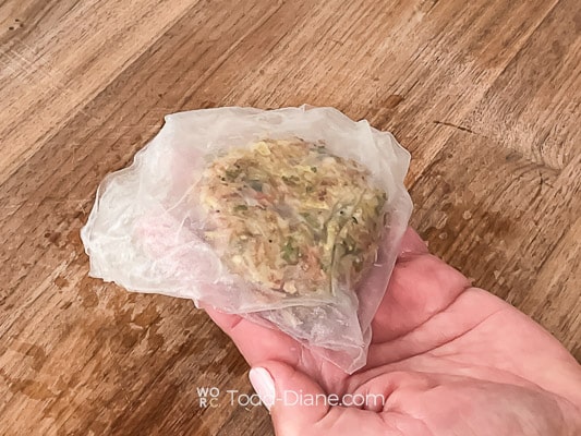 holding rice paper egg roll