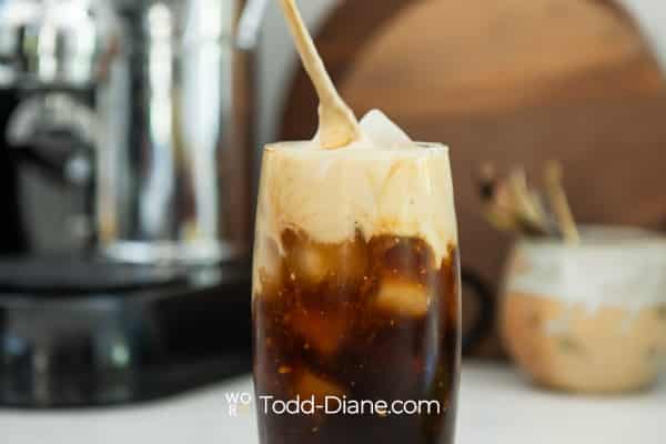 stirring the banana cream into the coffee