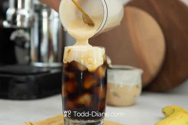 adding banana cream to the iced coffee