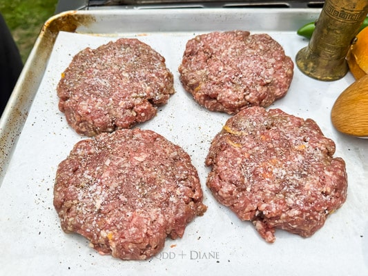 Raw patties seasoned with salt and pepper