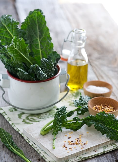 baked kale chips recipe on a cutting board