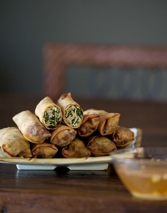 Kale Chicken Egg Rolls stacked on a plate