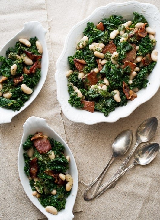 Kale, bacon and white bean salad on a serving plate