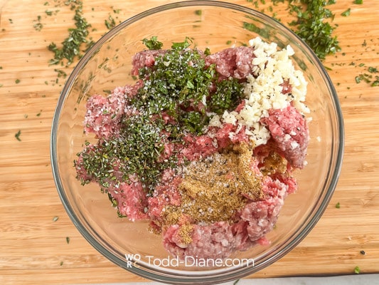 bowl of lamb burger meat with marinade