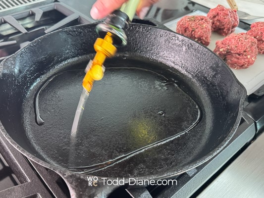 adding oil to pan