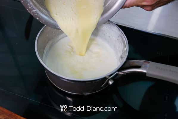 pouring egg mixture back into hot milk