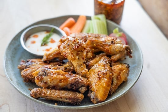 chicken wings with chili crunch oil on plate 