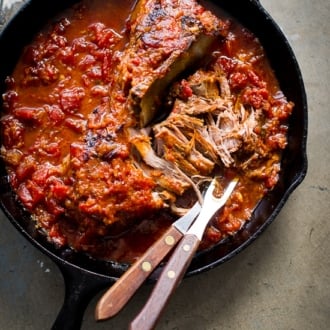 Juicy Asian Oven Pulled Pork in a skillet