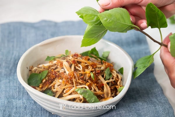 fresh herbs over noodles