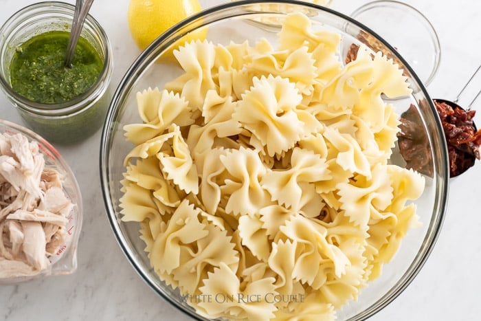 pesto chicken recipe with pasta on whiteonricecouple.com