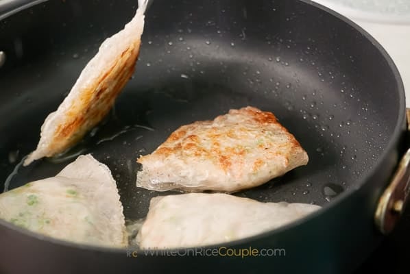 1/2 cooked dumpling in pan
