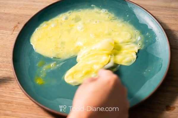 Beating egg on a plate