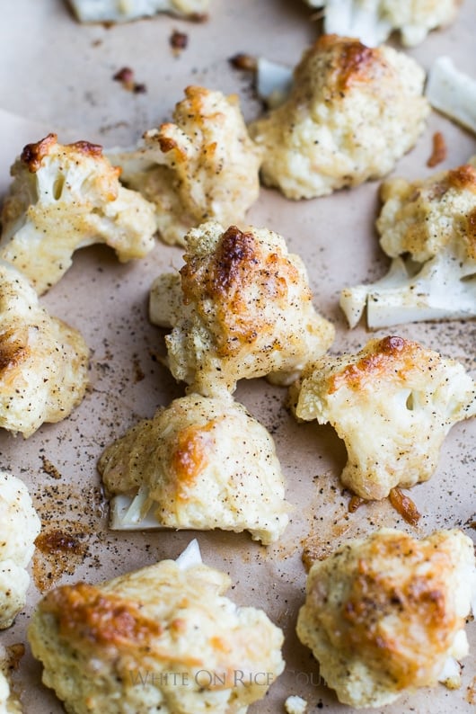 Roasted Cauliflower with Cheese "Frosted Cauliflower" on a baking sheet
