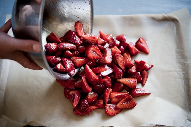 cut berries on roasting pan 