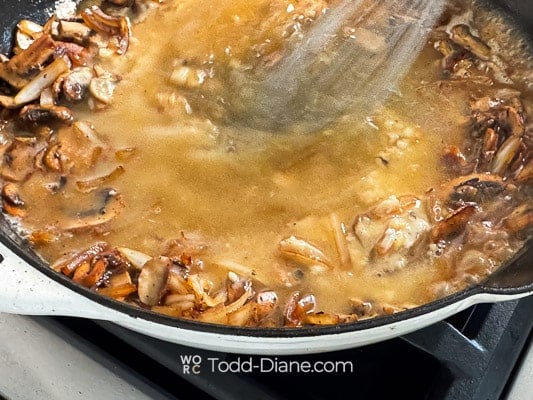 Whisking in remaining broth