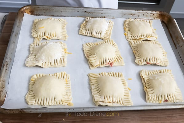 raw pastries on sheet pa