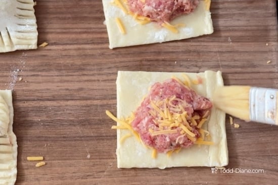 Brushing egg along edge of pastry