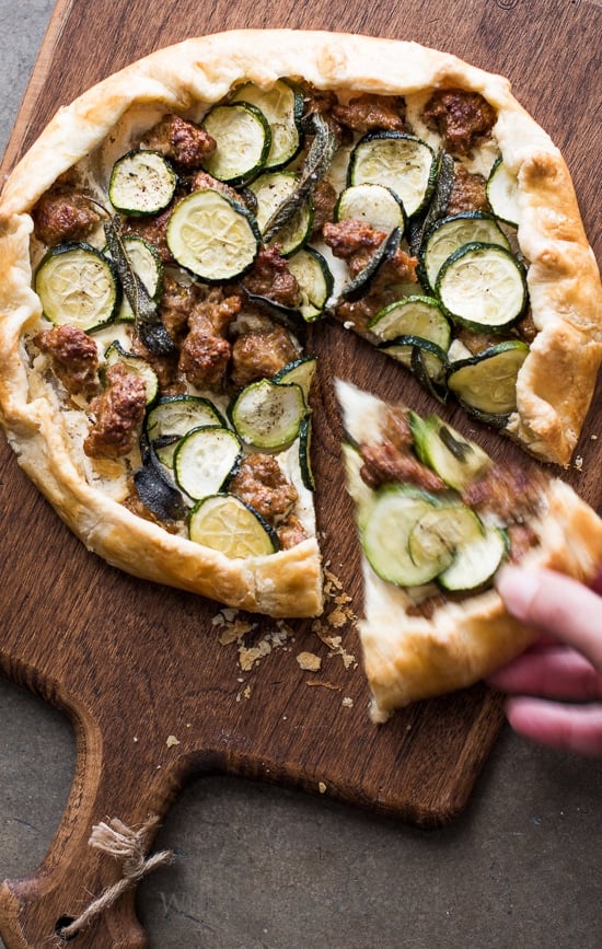 Sausage and Zucchini Galette on a cutting board