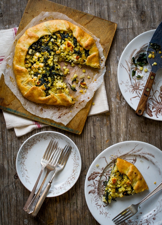 Savory Kale, Corn and Feta Cheese Galette on a cutting board