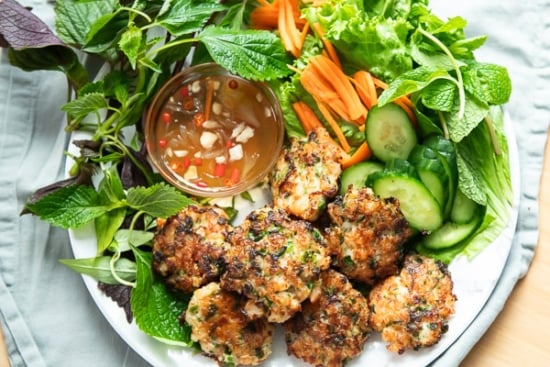 serving shrimp cakes with lettuce herbs