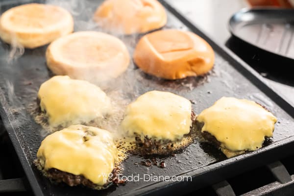 Cheese added to burger patties