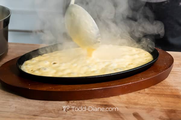 sizzling cheese on plate for burgers