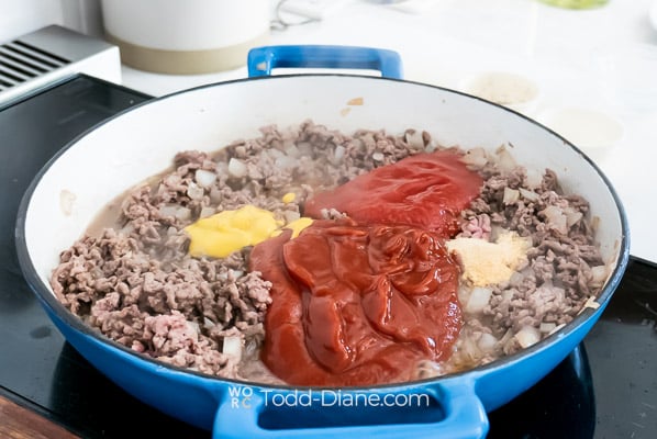 adding spices and sauce