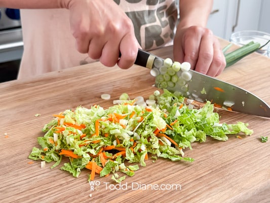 chopping vegetables for egg roll filling