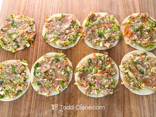filling spread on dumpling wrappers