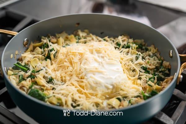 adding cheese and milk