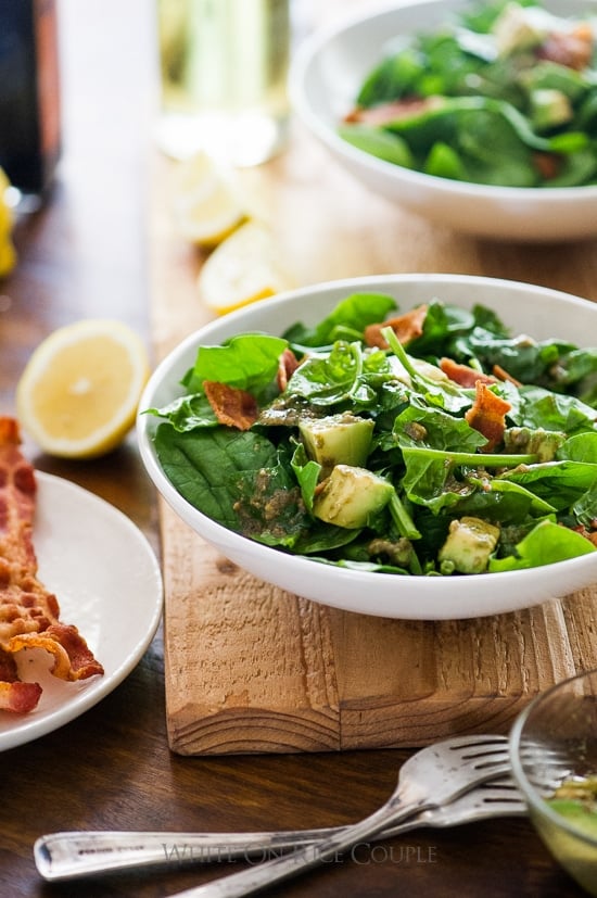 Bacon Spinach Salad with Amazing Avocado Vinaigrette in a bowl