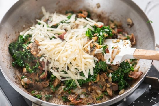 adding parmesan