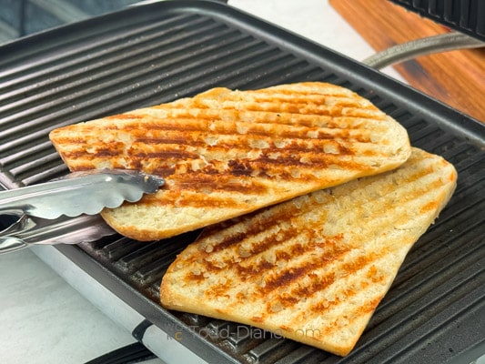 grilling the bread to be thin