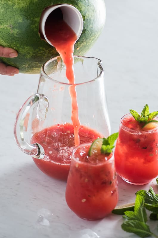 Inside-A-Watermelon Mojito pouring into glass jar